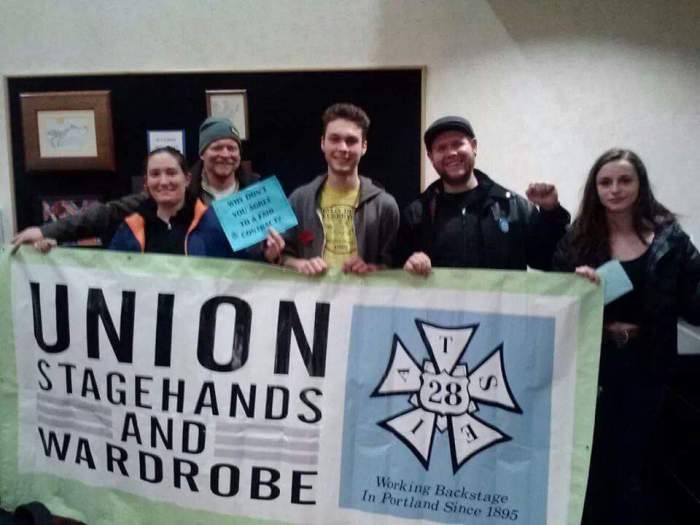 Becca (left) with Local 28 banner.